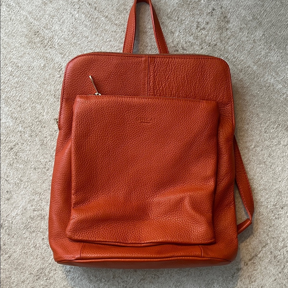 EUC Unica! 3-in-1 Orange Leather Backpack,  Crossbody, Shoulder Bag